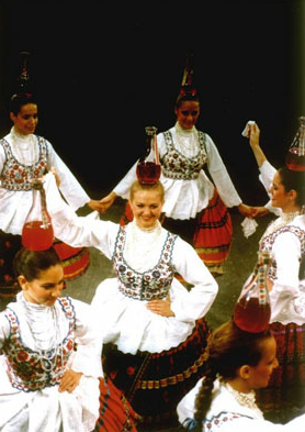 Hungarian folk dancers - balancing bottles with great skills